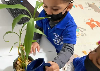 Kid take care of plant